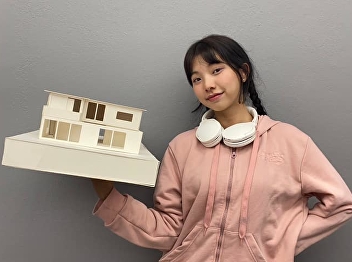 The smile of a child building a house